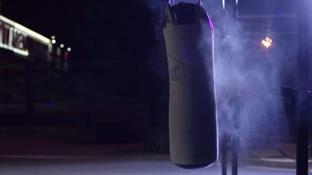 Gym,Punching bags. Punching bags in boxing room, sport. Punching bag at the dark sports ground.