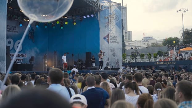 Ekaterinburg, Russia - August, 2019: Concert in the Town on the street, stage. Action. Male singer on stage on a holiday in the city.