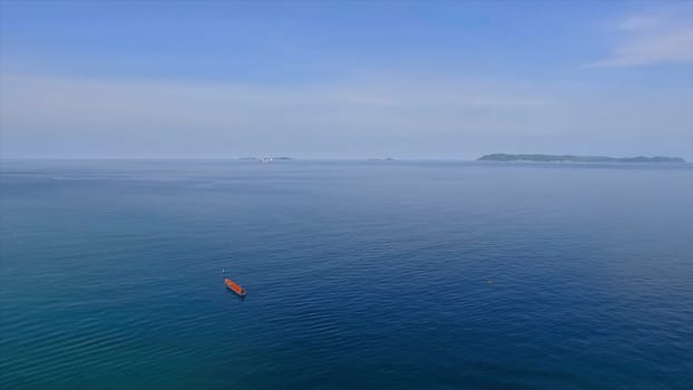 Amazing view to Yacht sailing in open sea at windy day. Drone view - birds eye angle , Little paradise island,Thailand. Beautiful crystal clear sea at tropical island, Koh Lipe, Andaman Sea, Thailand. Boat on the sea on blue sky white cloud