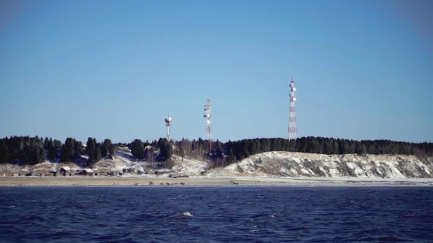 The seashore by which the ship sails. CLIP. View from the ship to the rocky shore where the cell towers are located.