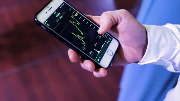 Businessman use smartphone check income from stock exchange worldwide. Stock. Online format holographic on phone have statistics finance in system.