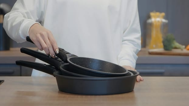 Restaurant. Frying pans. Action. Dishes next to which the chef is going to cook. High quality 4k footage