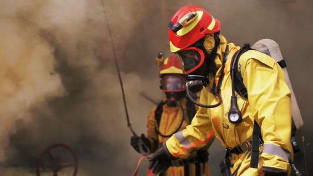 Firefighters use their equipment. Clip. Rescuers use water to extinguish or check the operation of the inventory