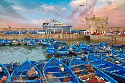 Boats at the harbor from Essaouria. Essaouria is the most popular Atlantic coast city in Morocco. at sunset