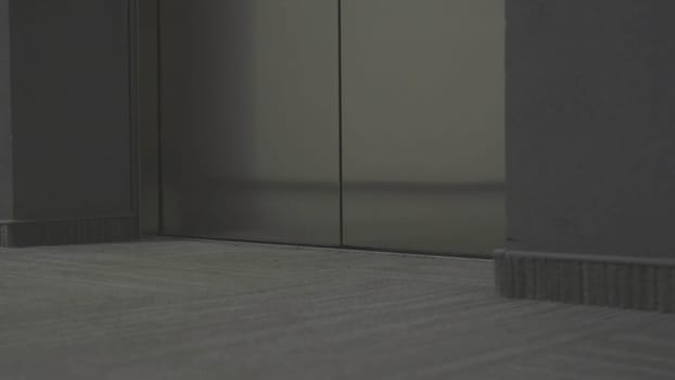 Man in black coming out of Elevator. Stock. Close-up of Elevator doors opening and man in black clothes getting out. Killer gets out of Elevator and goes to victim's door.