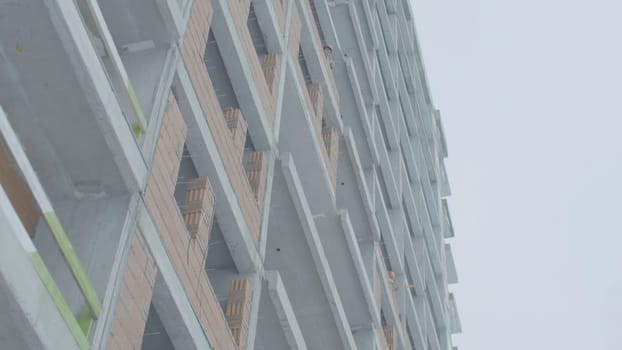 Facade of a modern apartment building. Construction of apartment buildings.
