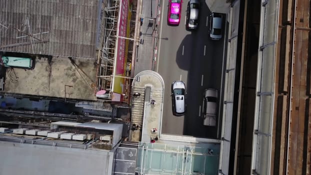Top view of bridge road and rails. Landscape building modern business district of Bangkok. X-shaped expressway, sky train railway in the foreground.