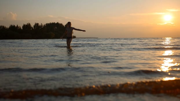 Boy having fun in sea waves on a summer day. Creative. Hot summer day during vacation