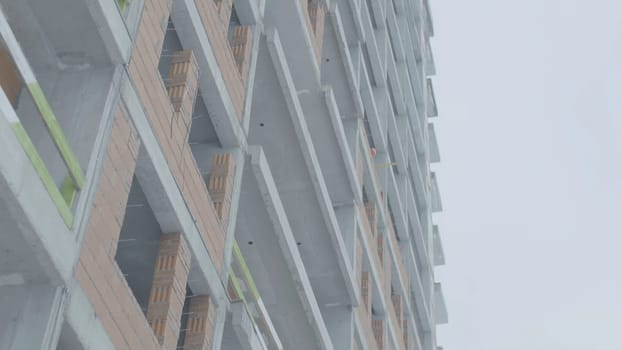 Facade of a modern apartment building. Construction of apartment buildings.