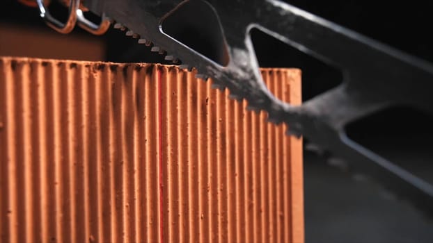 Close-up of automatic saw for bricks preparing for the cutting. Building and constructions concept