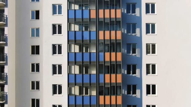 Close-up view facade of the beautiful colorful of a tall residential building. High-rise buildings modern architecture skyline.