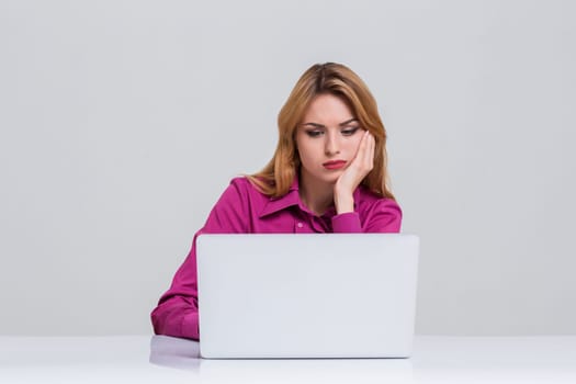 Young businesswoman working at laptop computer. she was tired and looking at monitor