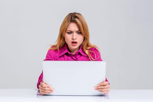 Young businesswoman working at laptop computer. she was surprised, prints and looking at monitor