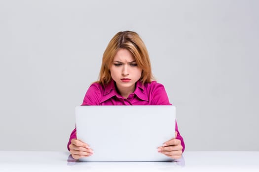 Young businesswoman working at laptop computer. she was surprised, prints and looking at monitor