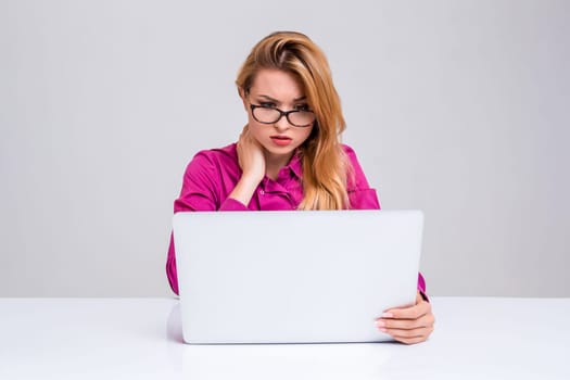 Young businesswoman working at laptop computer. she was tired and looking at monitor