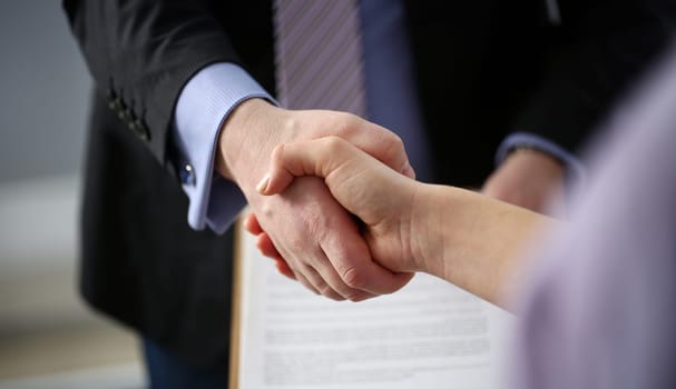 Man in suit and tie give hand as hello in office closeup. Friend welcome mediation offer positive introduction thanks gesture summit participate executive approval motivation male arm strike bargain