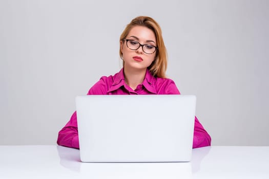 Young businesswoman working at laptop computer. she was tired and looking at monitor