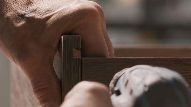 Painstaking work. Creative. Strong strong male people who assemble furniture in parts and special details. High quality 4k footage