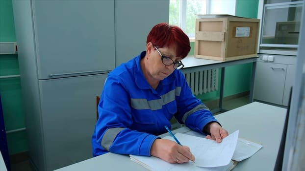 Hospital attendants. Clip. Working women filling out journals and describing tests. High quality FullHD footage