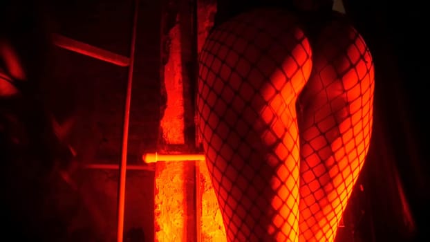 Man Hits a Woman Leather Whip. Strong man hands holding whip, bdsm. Man beats the girl on the ass.