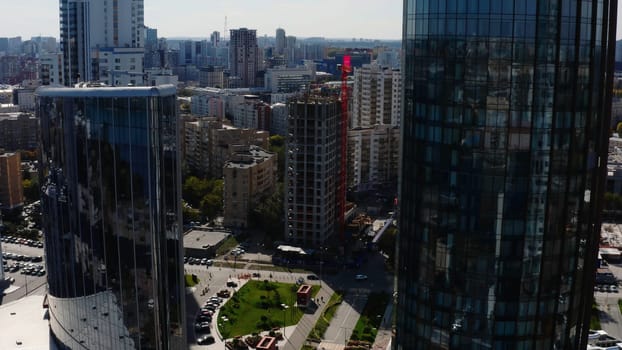 Top view of beautiful modern city on sunny summer day. Stock footage. Beautiful panorama of big city on summer day. Architecture and buildings in center of big city.