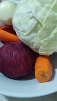fresh vegetables in a bowl for salad or soup, cabbage, peppers, beets and carrots food cooking lunch dinner. High quality photo