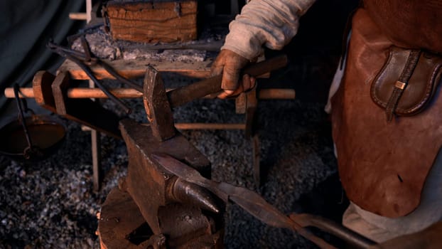 A man working in special clothes. Media. An adult man who works in the manufacture of iron products. High quality 4k footage