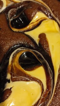 chocolate cake sponge cake with yellow cream, dessert sweets food. High quality photo