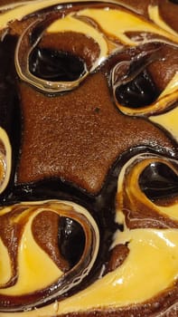 chocolate cake sponge cake with yellow cream, dessert sweets food. High quality photo