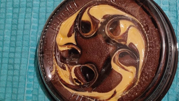 chocolate cake sponge cake with yellow cream, dessert sweets food. High quality photo