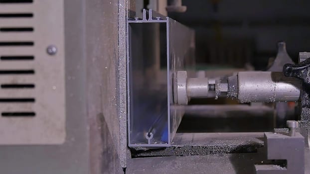 Making new stained glass using special equipment or machine. Pressed in the press bar of metal or aluminium circular saw cuts smoothly and flying debris. Pendular electric saw for metal cutting,