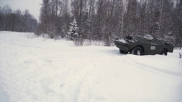 Throw a grenade in a military tank. Clip. Soldier throws a hand grenade into a battle tank or armored personnel carrier, winter backround, Soldier throws a training grenade into a tank in the winter forest. War concept.