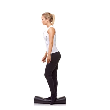 Woman, exercise and mat in studio for balance, pilates or workout for healthy body, wellness or fitness. Person, face and yoga in sportswear for physical activity on mock up space or white background.