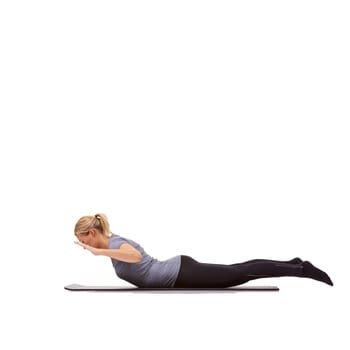 Woman, back extension and yoga exercise in studio for fitness, workout and stretching body on mockup white background. Profile of healthy lady balance on mat for strong core, training and locust pose.