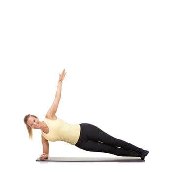 Woman, yoga and mat in studio for stretching, fitness or workout for healthy body, smile and core muscle. Person, portrait and pilates on floor for abdomen health on mockup space or white background.