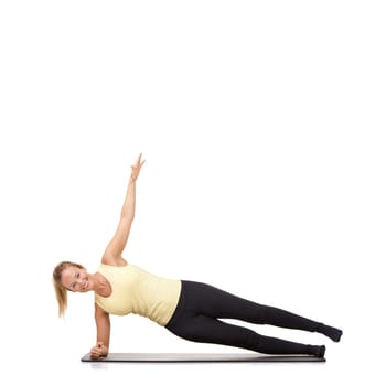 Woman, pilates and mat in studio for stretching, fitness or workout for healthy body, happy or core muscle. Person, portrait or yoga on floor for abdomen health on mockup space or white background.