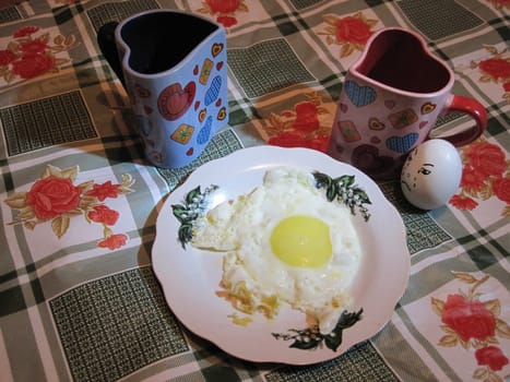 Eggs and mugs of tea on the kitchen table