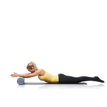 Fitness, foam roller and woman in a studio for exercise, stretching or gym routine with yoga mat. Stability, balance and young female athlete from Australia with body workout by white background