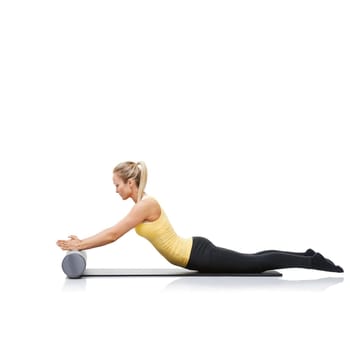 Health, foam roller and woman in a studio for exercise, stretching or gym routine with yoga mat. Stability, balance and young female athlete from Australia with body workout by white background