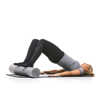 Core exercise, foam roller and studio woman with bridge workout, balance activity or wellness for gym pilates on floor. Fitness, mockup space and girl body development on yoga mat on white background.