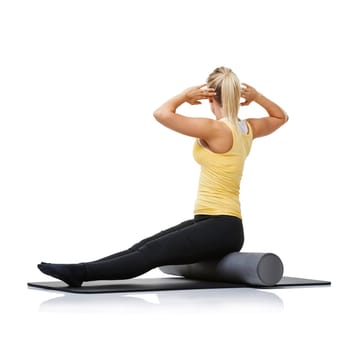 Yoga fitness, foam roller and person stretching back for spine posture training, wellness challenge or active performance. Studio floor, exercise mat and athlete physical activity on white background.