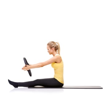 Woman, pilates ring and arms for stretching exercise on yoga mat or resistance healthy, roll up or studio white background. Female person, equipment for muscle flexibility, wellness balance or mockup.