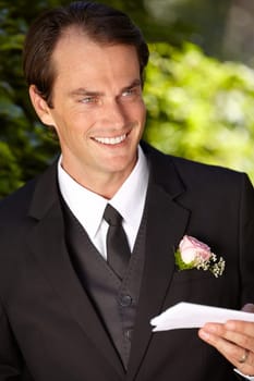 Man, paper and outdoor at wedding marriage for commitment ceremony, promise speech or romance party. Male person, vows and reading as groom for partnership celebration, relationship trust or love.
