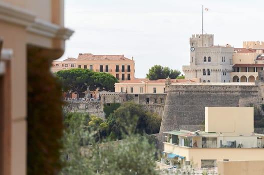 Monaco, Monte Ville, 27 September 2022 - Palace of Prince of Monaco, mountain of royalty, walls of old town, flag of principality . High quality photo