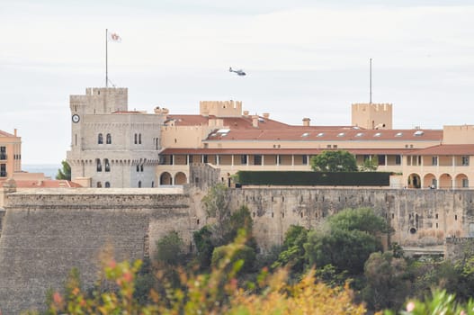 Monaco, Monte Ville, 27 September 2022 - Palace of Prince of Monaco, mountain of royalty, walls of old town, flag of principality . High quality photo