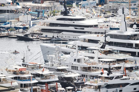 Monaco, Monte Carlo, 27 September 2022 - a lot of luxury yachts at the famous motorboat exhibition in the principality, the most expensive boats for the richest people around the world, yacht brokers. High quality photo