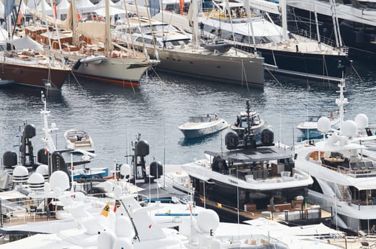 Monaco, Monte Carlo, 27 September 2022 - a lot of luxury yachts at the famous motorboat exhibition in the principality, the most expensive boats for the richest people around the world, yacht brokers. High quality photo