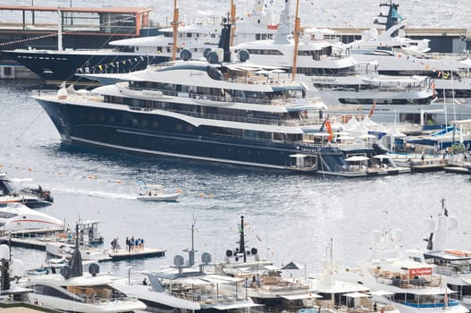 Monaco, Monte Carlo, 27 September 2022 - a lot of luxury yachts at the famous motorboat exhibition in the principality, the most expensive boats for the richest people around the world, yacht brokers. High quality photo