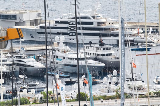 Monaco, Monte Carlo, 27 September 2022 - a lot of luxury yachts at the famous motorboat exhibition in the principality, the most expensive boats for the richest people around the world, yacht brokers. High quality photo