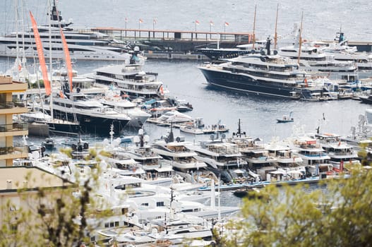 Monaco, Monte Carlo, 27 September 2022 - a lot of luxury yachts at the famous motorboat exhibition in the principality, the most expensive boats for the richest people around the world, yacht brokers. High quality photo